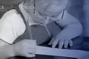 young disabled girl writing