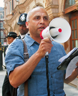 ALLFIE's chair, Navin Kikabhai, on a demo with a loudhailer