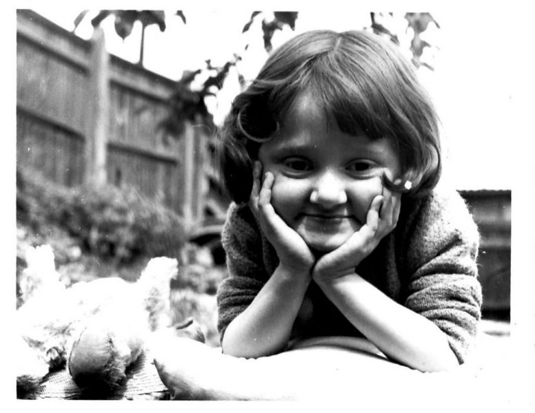 Micheline Mason (ALLFIE's former CEO) as a small child, smiling at the camera