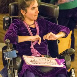 Maresa in her wheelchair at an event